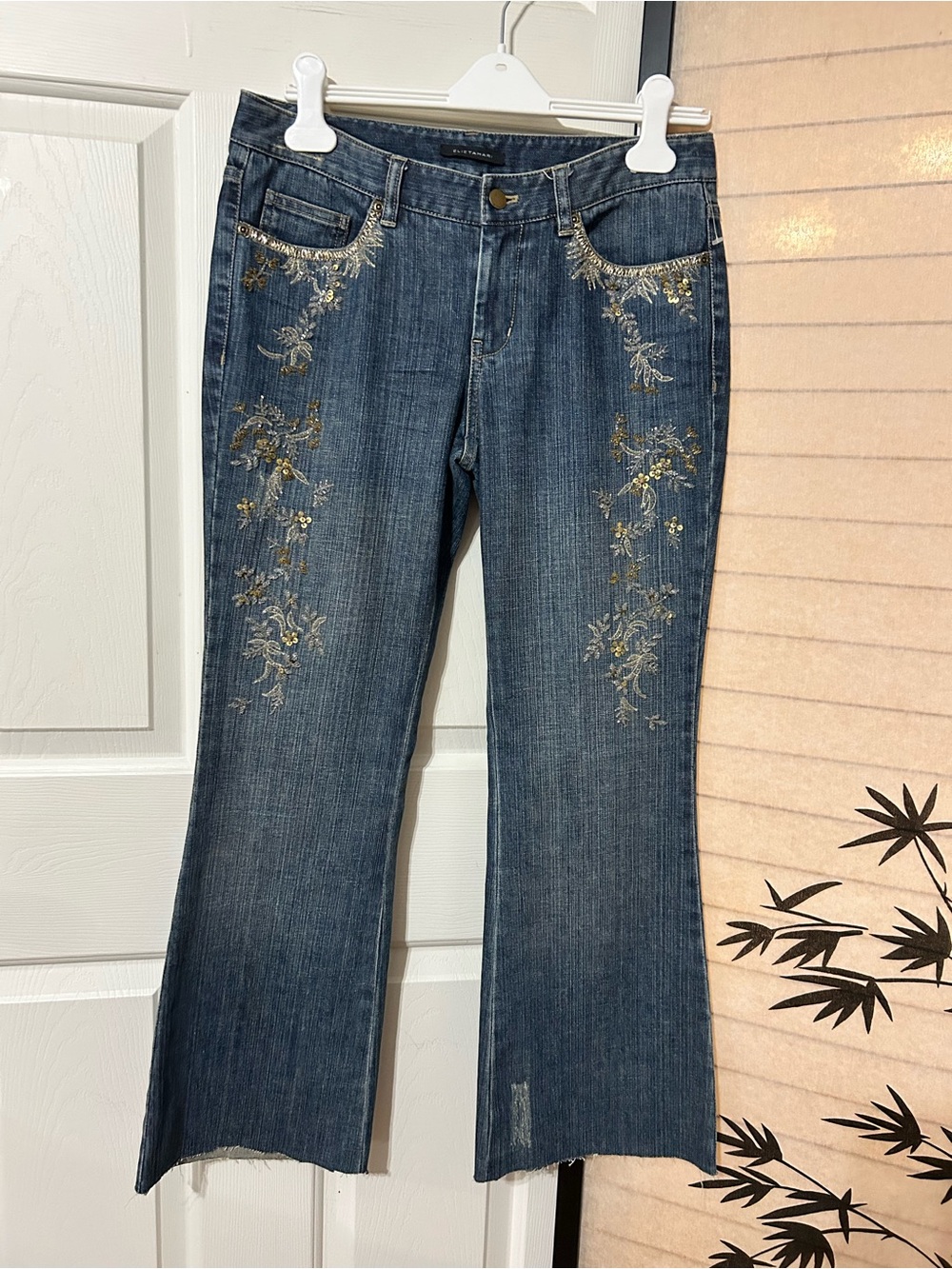 Elie Tahari Blue Jeans with Gold Floral Embroidery Flare Semi Distressed Raw Hem